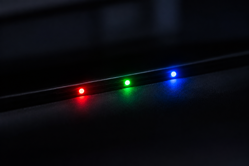 How Do LED Neon Signs Work — visual for the section “Where the Colors Come From”: dark scene, glowing neon focal point, shallow depth of field