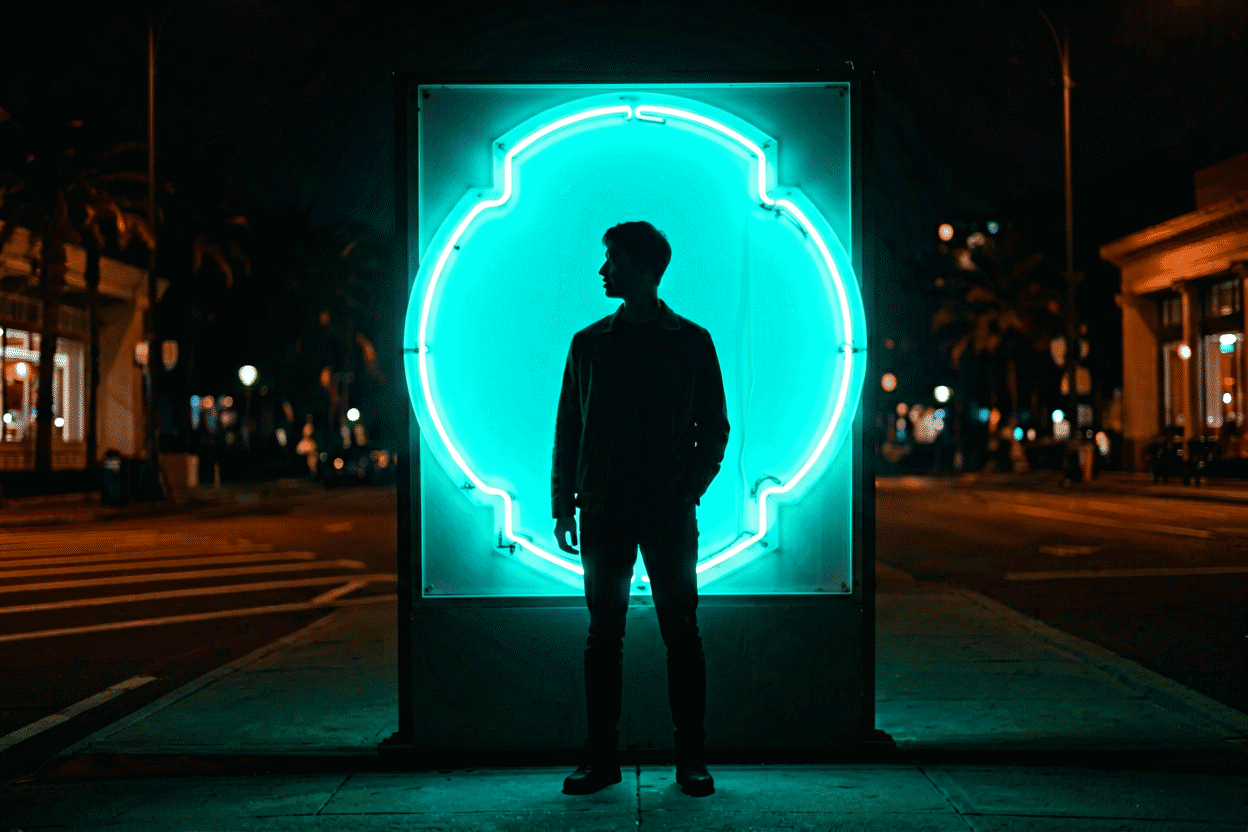 How to Photograph a Neon Sign — visual for the section “Scene Two: The Portrait With Neon (The Instagram Classic)”: dark scene, glowing neon focal point, shallow depth of field