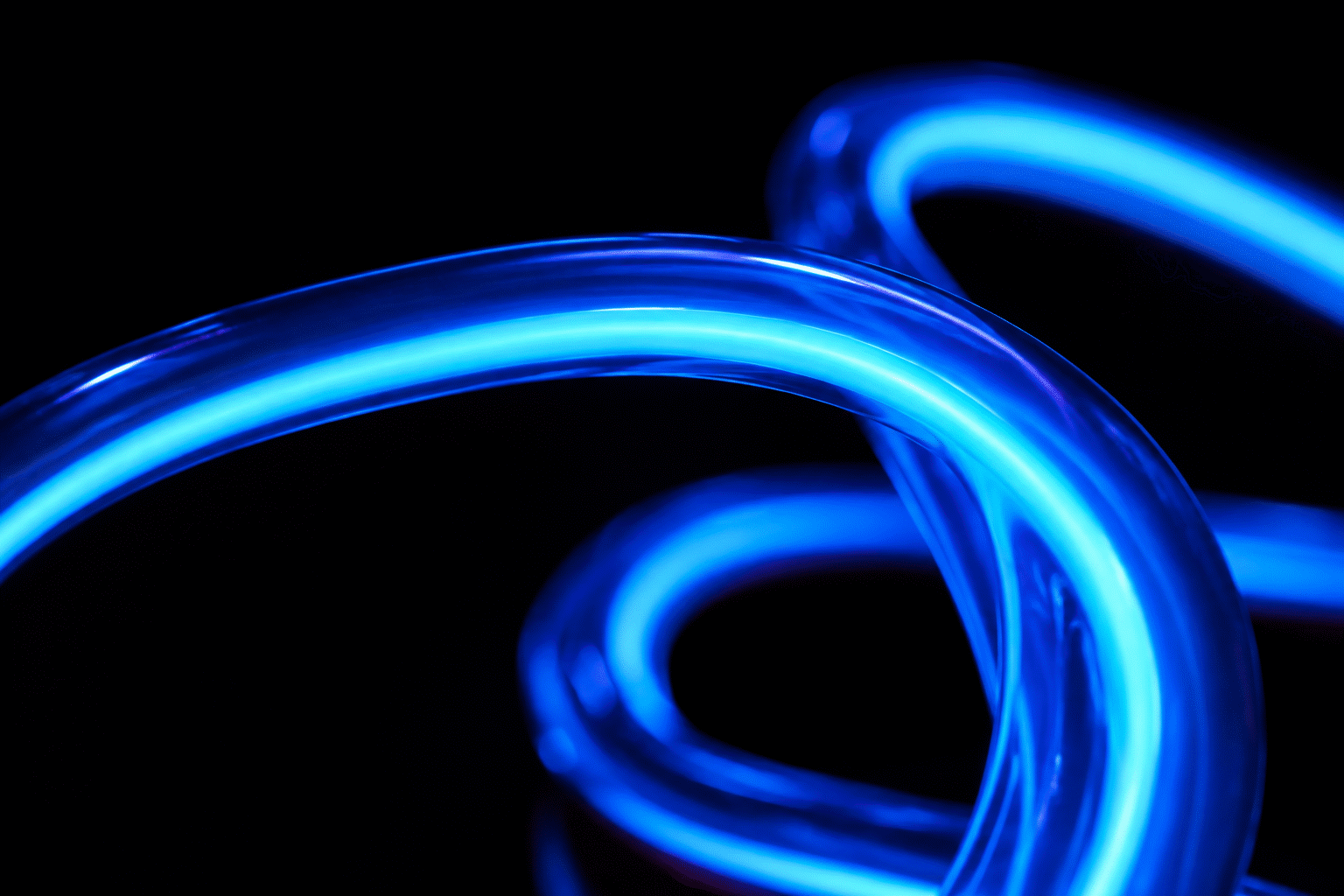 Neon on Black Background — visual for the section “Rule 3: Adjust Letterforms for Contrast (Weight and Space)”: dark scene, glowing neon focal point, shallow depth of field