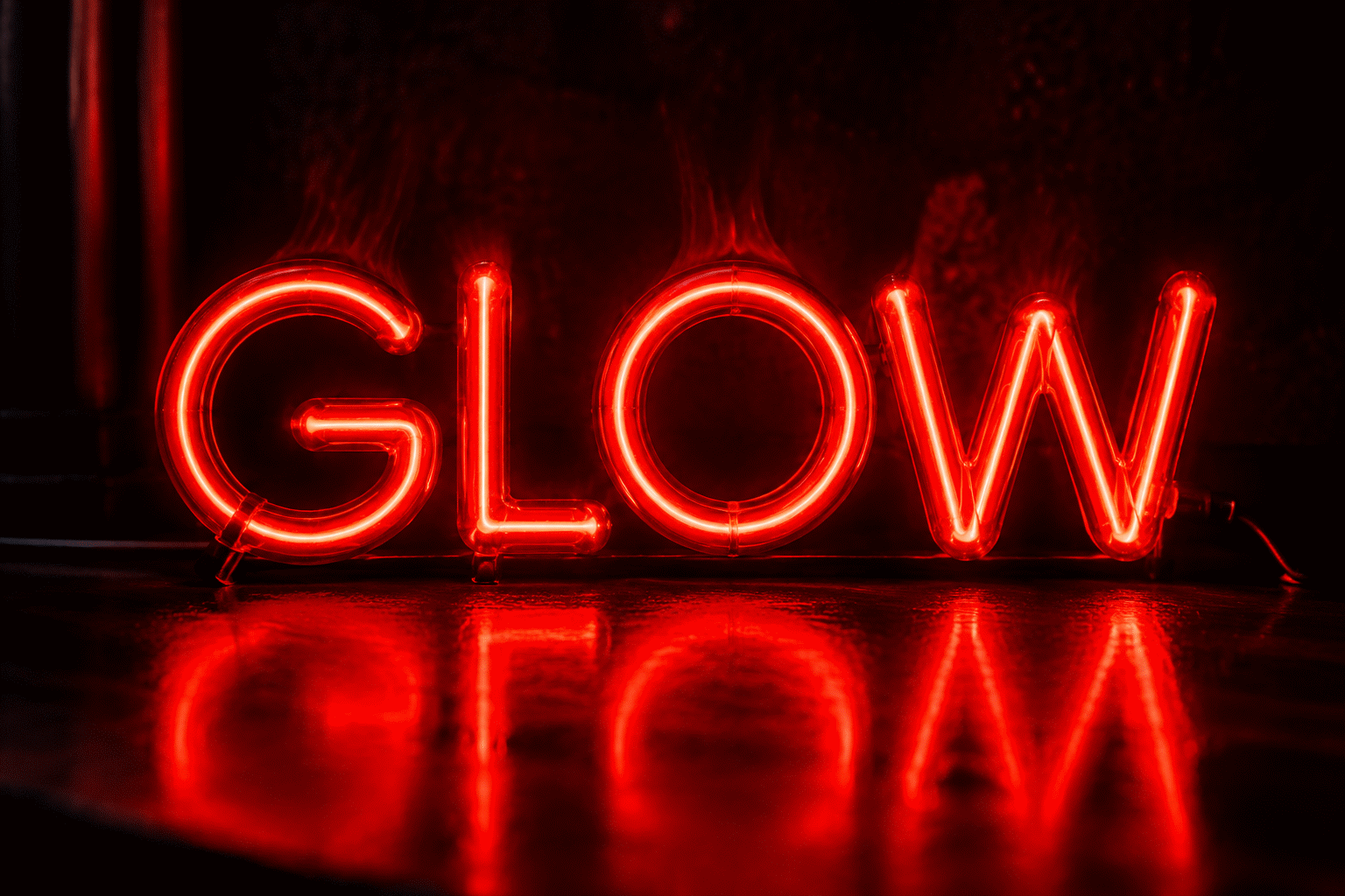 Dark scene with a glowing red neon sign reading GLOW
