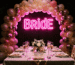 Dark scene with a glowing hot pink neon sign reading Bride
