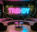 Dark scene with a glowing gradient pink-blue neon sign reading TRENDY
