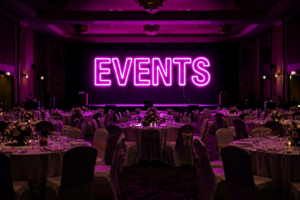Dark scene with a glowing magenta neon sign reading EVENTS